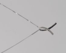 A 9ct white gold necklace with ribbon pendant marked 375 to pendant and chain. Weight 1.