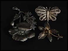A silver filigree continental ladies brooch in the form of a butterfly together with a filigree