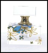 A 20th century Art Deco style glass perfume bottle - scent bottle of cut glass with bow and ribbon