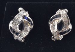 A pair of white gold sapphire and diamond stud earrings - studs.