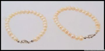 2 vintage ( pair of )  20th century ladies matching cultured pearl bangles each with white metal