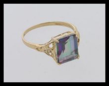 A 9ct gold and mystic topaz ladies ring.