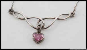 A silver ladies Art Nouveau style pendant necklace with chain.