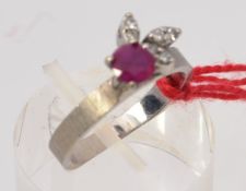 A ladies 14ct white gold ruby and diamond ring.