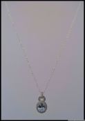 A 925 designer pendant necklace with sylised lock pendant set with a large oval CZ surrounded by