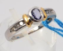 A ladies 14ct white gold sapphire and diamond ring,