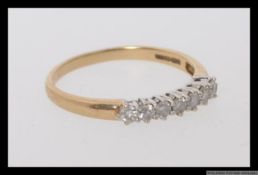 A 9ct gold and diamond ring set with approximately 25pt diamonds. Hallmarked GA Sheffield. Weight 1.