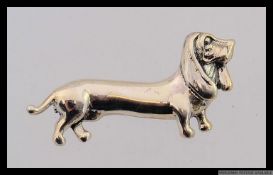 A 925 silver Dachshund sausage dog brooch. Weight 7.5g. Length 5cms.