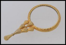 A 20th century gilt metal puzzler.