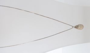 A stunning silver and white metal pineapple pendant and necklace.