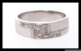 A 9ct white gold and diamond ring with 8 illusion set diamonds. Hallmarked for Sheffield. Weight 4.