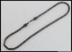 A silver 925 Byzantine black oxidised Bali necklace of snake link form.