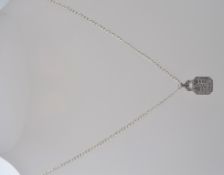 A ladies silver and cz stone inset pendant necklace on silver chain.