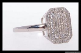 A 925 silver cocktail ring in the Art Deco style encrusted with pave set CZ gems. Weight 4.7.