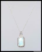 A 925 silver pendant necklace with Art Deco style drop pendant inset with an opalite losenge