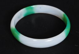 A 20th century Chinese oriental green and white jade bangle bracelet

FREE UK POSTAGE ON ALL LOTS