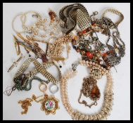 A collection of costume jewellery to include necklaces, tiepins, choker, mosaic bracelet,