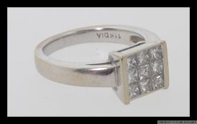 A 9ct white gold and diamond ring with .50pts of pave set diamonds Weight 4.4g. Size I.