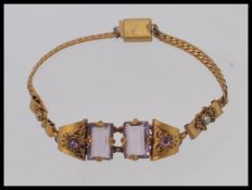 A mid century vintage gilt metal and amethyst set ladies bracelet.