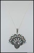A 925 silver pendant necklace with large art nouveau peack uncrusted with marcasite and studed with