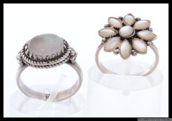 Two silver dress rings with white gem set stones marked 925. Sizes O , P. Weight 8.3g.
