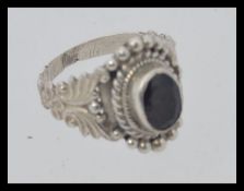 A silver and ruby garnet stone ladies dress ring.