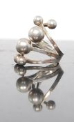 A contemporary silver 925 marked Danish oversized ladies atomic / sputnik ring.