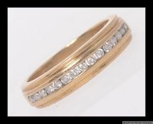 A 9ct gold and diamond half eternity ring set with 25pt diamonds. Marked 375. Weight 3.6g. Size L.