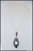 A 925 silver pendant necklace with oval Art Deco style pierced pendant encrusted with marcasite,