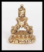 A believed Victorian yellow metal (tests as 15ct gold) and carnelian stone carved wax seal.