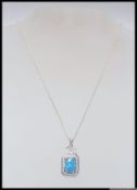 A 925 silver Art Deco style necklace embellished with an oval opalite within a padlock style