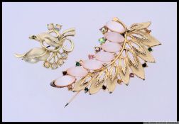 A stunning near pair of costume jewellery brooches set with amethyst and agate stones over yellow