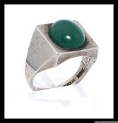 A vintage silver dress ring with central green gem hallmarked for Birmingham A.J &Co. Size Q.