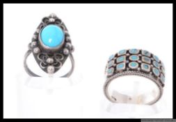 Two silver dress rings with turquoise decoration. Size K, M.