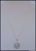 A 925 silver designer pendant necklace with alternating baguette and brilliant cut CZ halos with