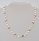 A 925 silver marked double cultured and agitated ladies pearl necklace with inset quartz stone