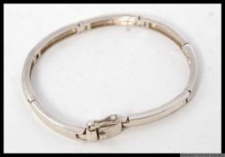 A contemporary ladies curb linked bracelet bangle. Stamped makers IM 925. Total weight 13.