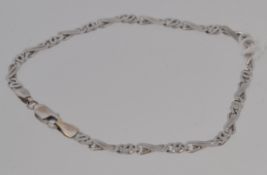 A 9ct white gold fancy flat link bracelet. Length 18cms. Weight 3.