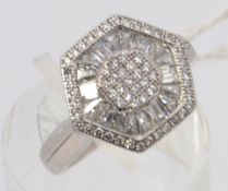A ladies contemporary hexagonal head silver and cz stone inset dress ring. Total weight 4.9g .