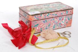 A Chinese enamel set tin with decorative