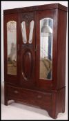 An Edwardian mahogany single wardrobe. T