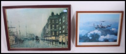 A framed and glazed print of a Lancaster