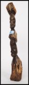 A carved African double bust totem being