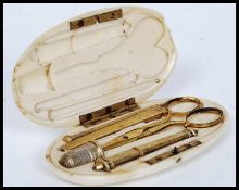 A 19th century ivory cased sewing set, t