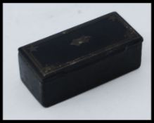 A 19th century papier mache snuff box of