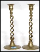 A pair of 17th century style twist brass