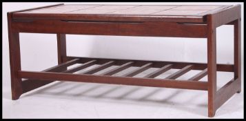 A 1970's retro teak and tile top rectang