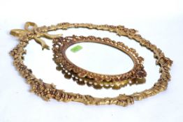 A 20th century reproduction Victorian style rococo wall mirror, with gilt painted brass surround,