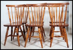 A set of 6 contemporary country pine stick back dining chairs Raised on turned legs united by