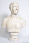 A white plaster bust of a statesman in the Roman
manner with oval plate 'Fosi Sg Corber Paris' H